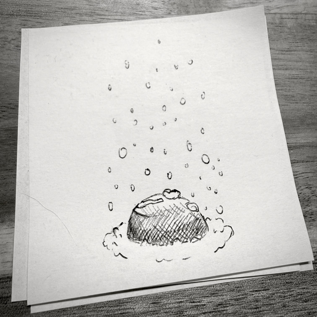 Croquis sur un post-it. Il montre de la neige qui tombe sur un caillou très légèrement enneigé, entouré de neige en cercle.